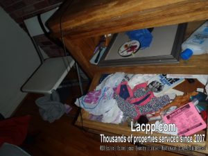 Open dresser drawers with clothes and toiletries