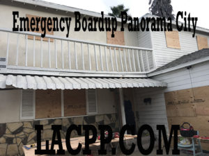 Emergency boarded-up two-story house with balcony
