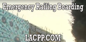 Emergency railing boarding sign on building